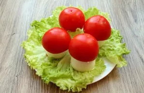 Put the caps on the stuffed eggs.