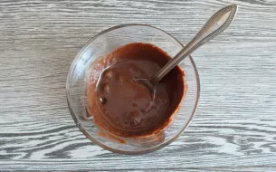 While the cake is cooling, add cocoa powder, pour the remaining 2 tablespoons of condensed milk and mix.