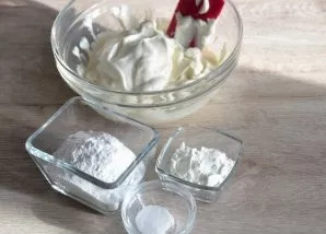 Add powdered sugar, 1/2 packet of vanilla sugar, and a pinch of salt to the curd mass. Mix the curd mass until smooth. To make it more co...