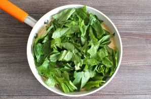 Add spinach to the pan. Simmer until the spinach wilts a bit.