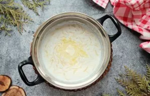 Remove the pot from the stove, add butter and cover the lid. Leave the soup for 5 minutes and serve.