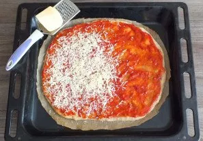 After the specified time, remove the baking tray with the patty from the oven. Do not turn off the oven. Spread tomato sauce over the bas...