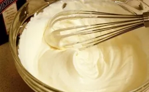 Beat the cream until a thick white foam.