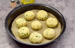 Form round buns and put in a baking dish.