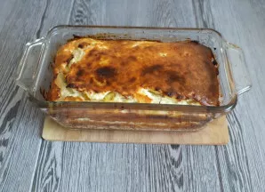 Remove the casserole from the oven.