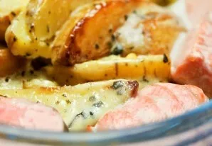 Bake in an oven preheated to 180C for about half an hour  until golden brown. Serve with fresh vegetables and herbs.