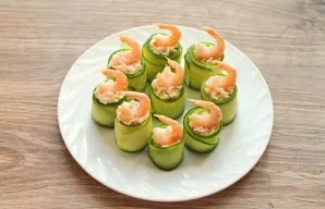Garnish with shrimp and herbs on top.