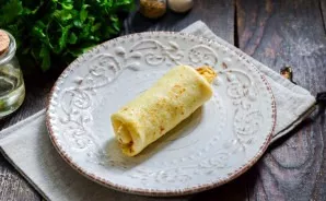 Roll up the pancake. Do the same with all the pancakes.