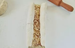 Bend the edges from both sides to the middle.