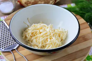 Grate the melted cheese for the filling.