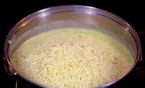 Grate the cheese on a fine grater to melt faster. Do not let it boil.