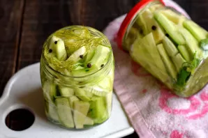 Remove the marinade from the stove, pour vinegar. Immediately pour it into jars. Remove all air bubbles inside. Tighten the jars tightly ...