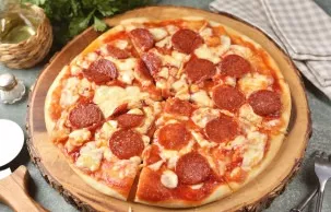 Serve the prepared pizza hot, cut it into triangles with a sharp knife.