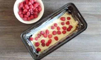 Place half of the amount of raspberries on the dough.