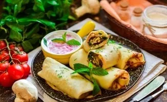 Pancakes stuffed with mushrooms
