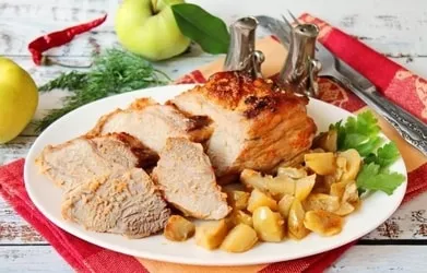 Pork with apples in the oven