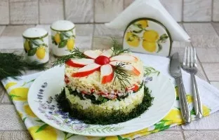 Layered salad with crab sticks