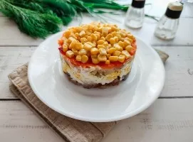 Layered salad with smoked fish